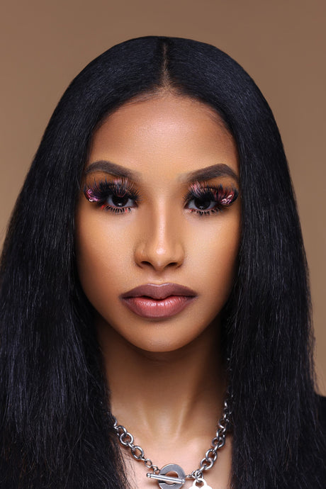 Model wearing pink color lash extensions with decorative lash decals – creative lash set by Trish Co