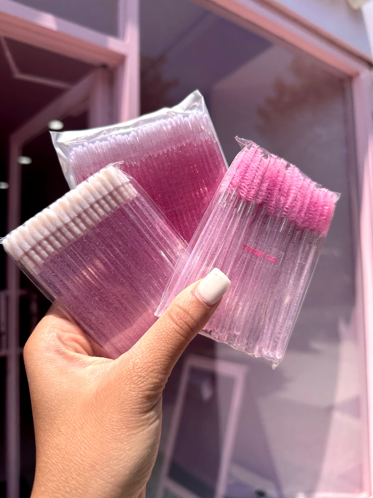 Lash application accessories – pink spoolies, lip wands, and microswabs bundle from Trish Co