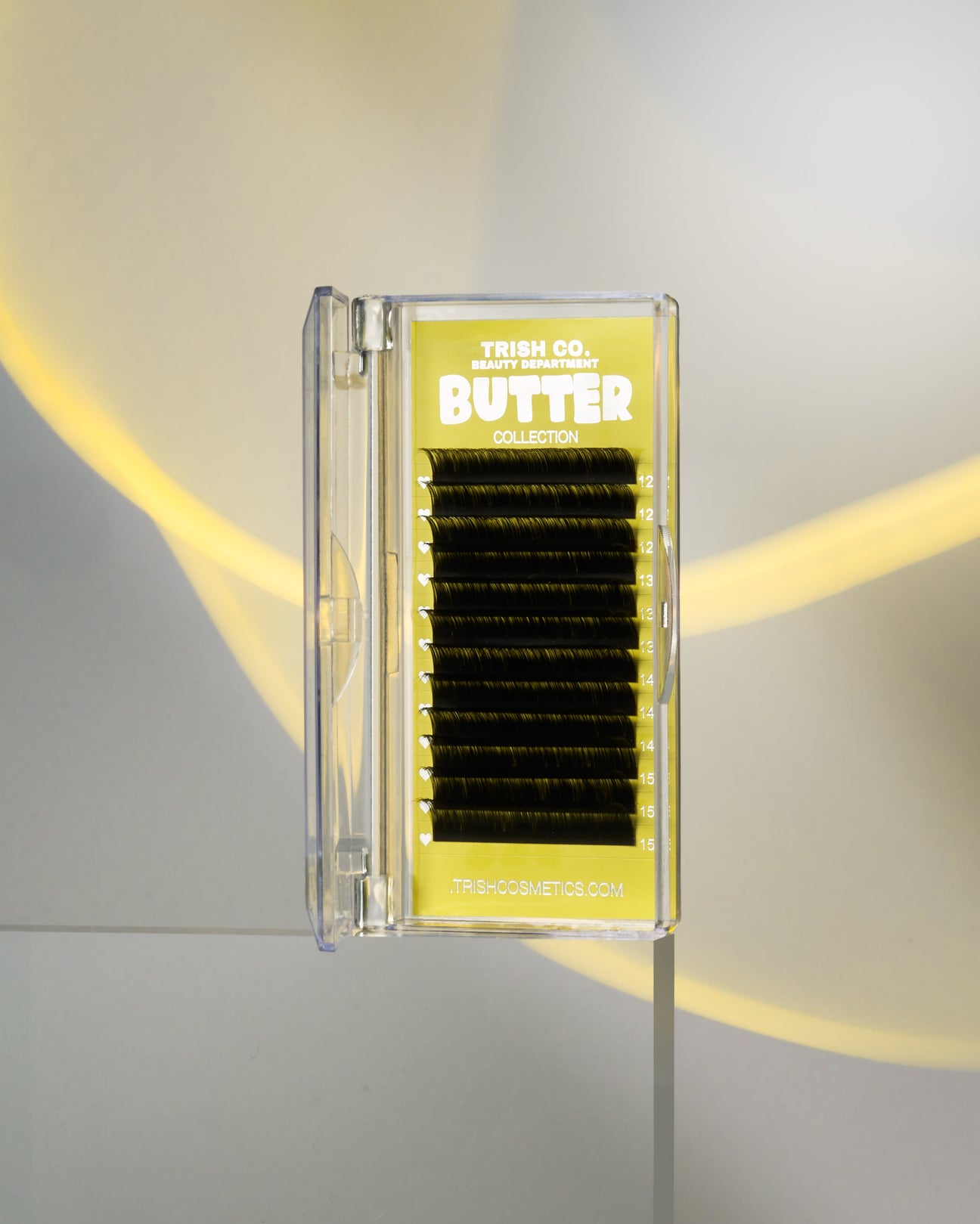 Front view of BUTTER Lash Tray – matte black volume lashes in sleek Trish Co packaging