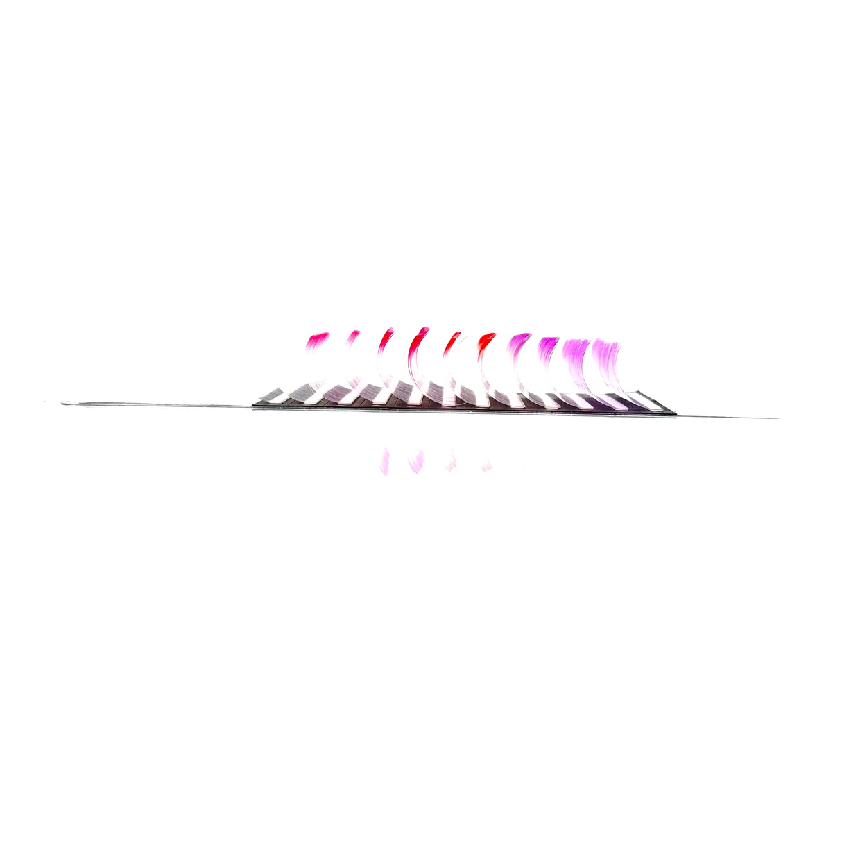 Side angle of White Series Lash Tray with white ombre CC curl .05 lashes in 14–18mm lengths from Trish Co