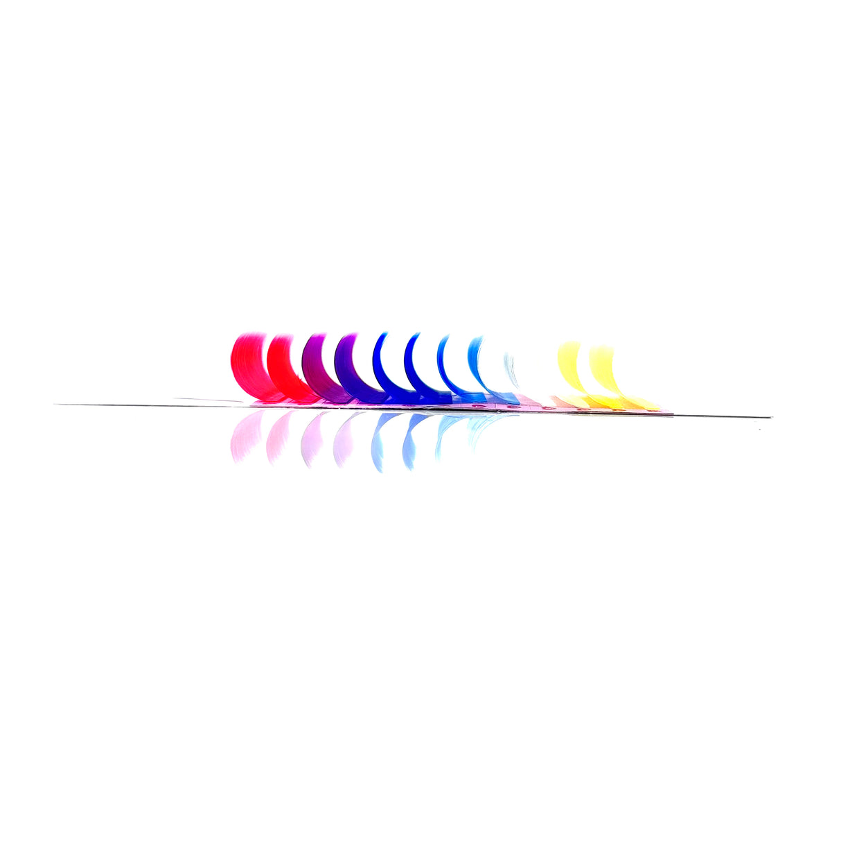 Side angle of OG Color Lash Tray displaying colorful CC curl .05 lash rows – white, pink, purple, blue, yellow