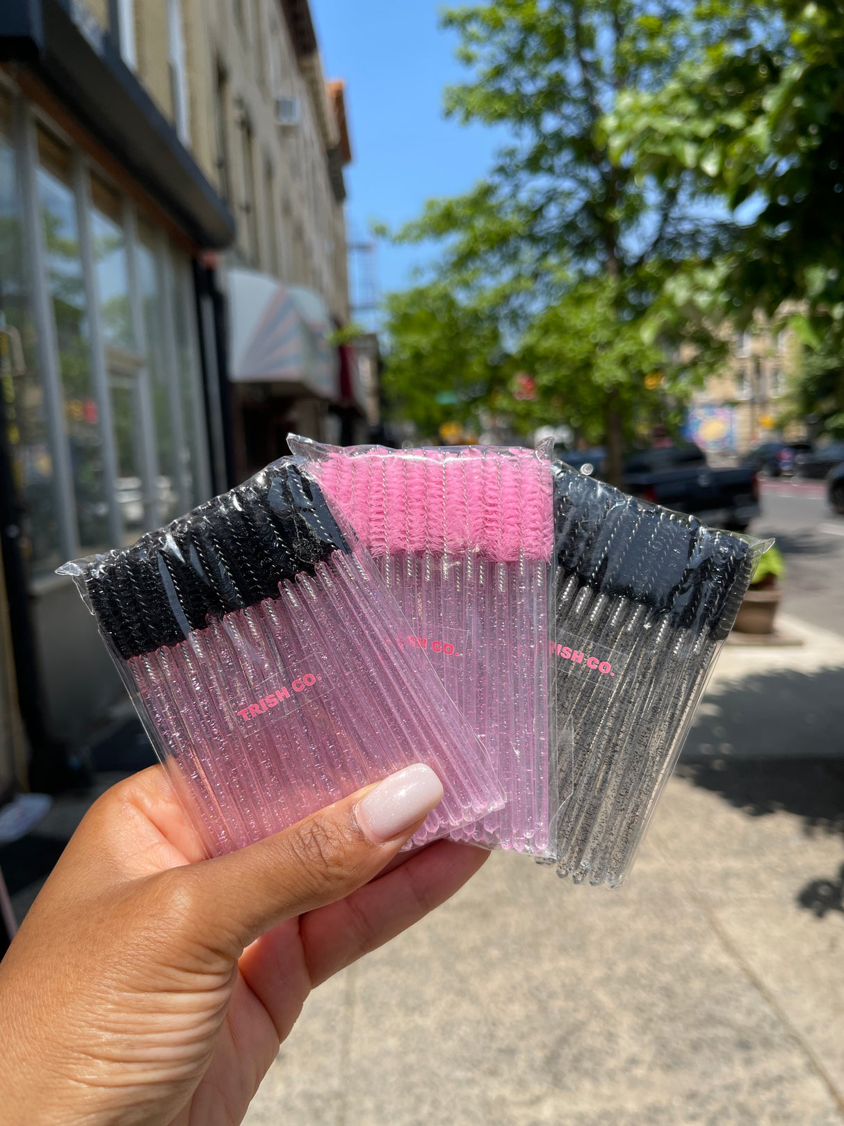 Set of colorful spoolie brushes – mix of black, pink, yellow, clear, and more for lash and brow grooming