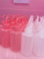 Pink squeeze bottle for lash rinsing and cleansing – perfect for lash extension aftercare